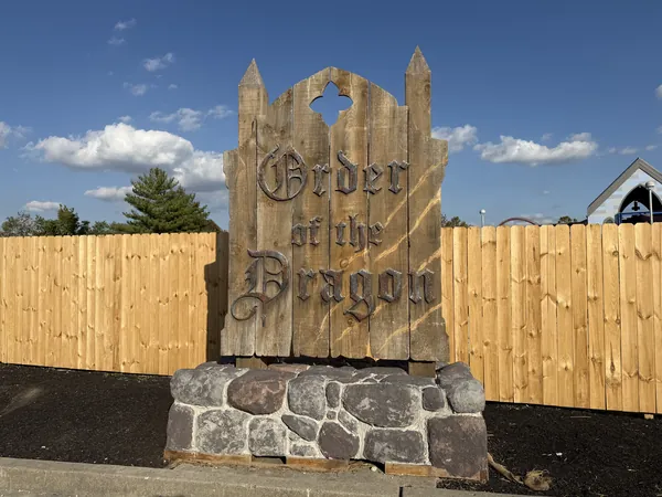 Carved wooden Order of the Dragon maze sign at Kings Island Halloween Haunt